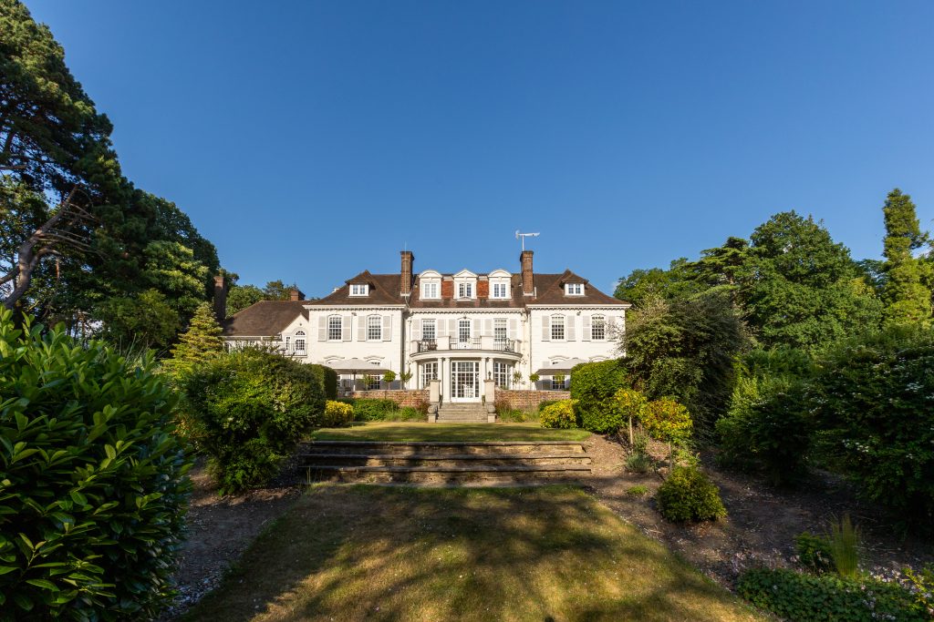 Exterior shot of Gorse Hill Hotel in Surrey, a historic Grade II listed manor house set in landscaped gardens.